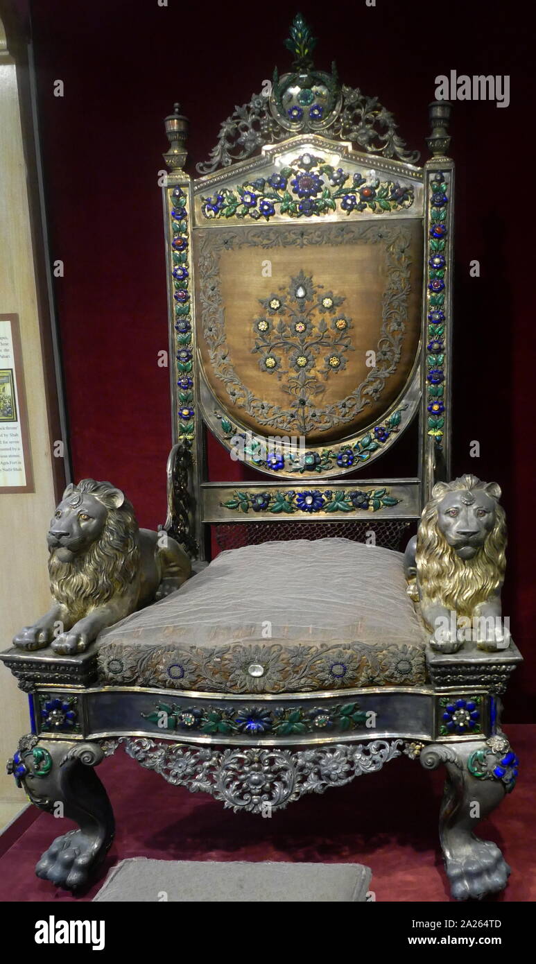 Mughal Jewel studded chair and foot rest, of king of Banaras. Northern India, Late 19th century. Wood, silver, precious stones, velvet Carved, enamelled, repousse work Stock Photo