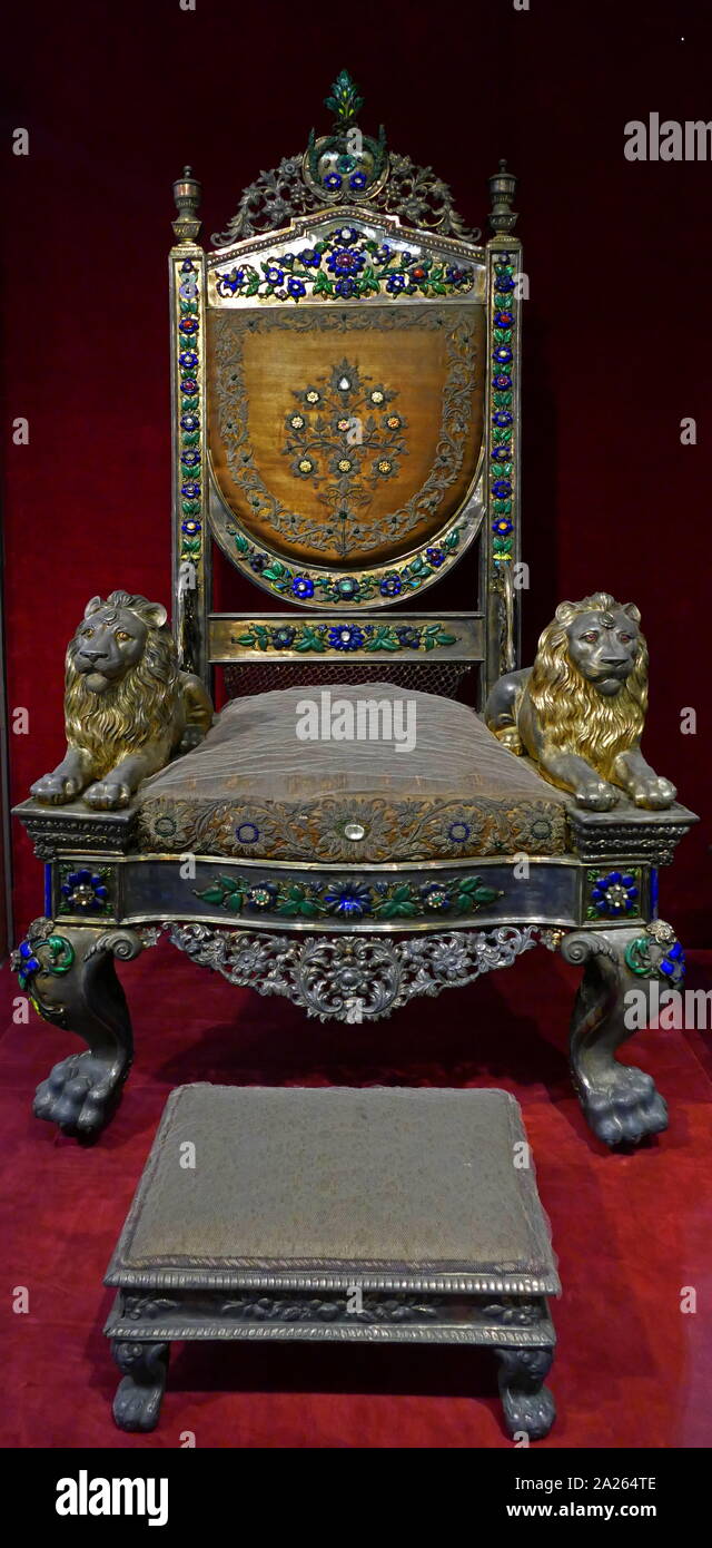 Mughal Jewel studded chair and foot rest, of king of Banaras. Northern India, Late 19th century. Wood, silver, precious stones, velvet Carved, enamelled, repousse work Stock Photo