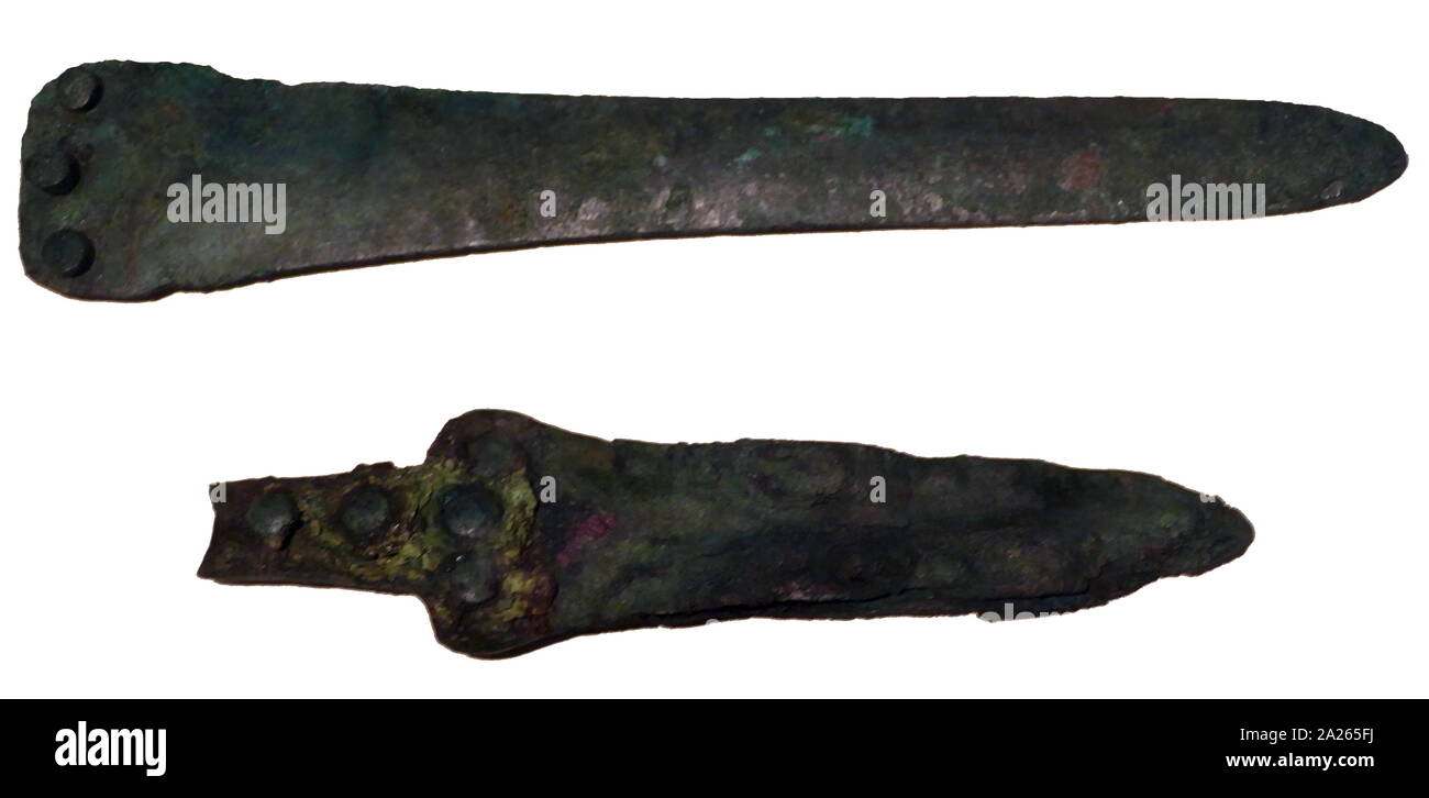 Bronze daggers from Akrotiri, a Minoan Bronze Age settlement on the volcanic Greek island of Santorini (Thera). The Greeks arrived in Crete during the Mycenaean Period, later than Akrotiri. The settlement was destroyed in the Theran eruption sometime in the 16th century BC and buried in volcanic ash Stock Photo