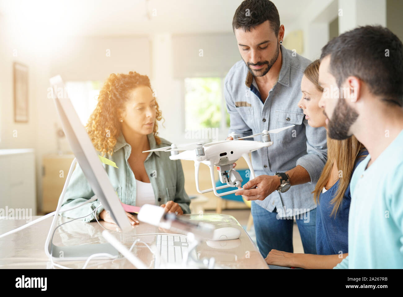 Startup people in office working on drone technology Stock Photo - Alamy
