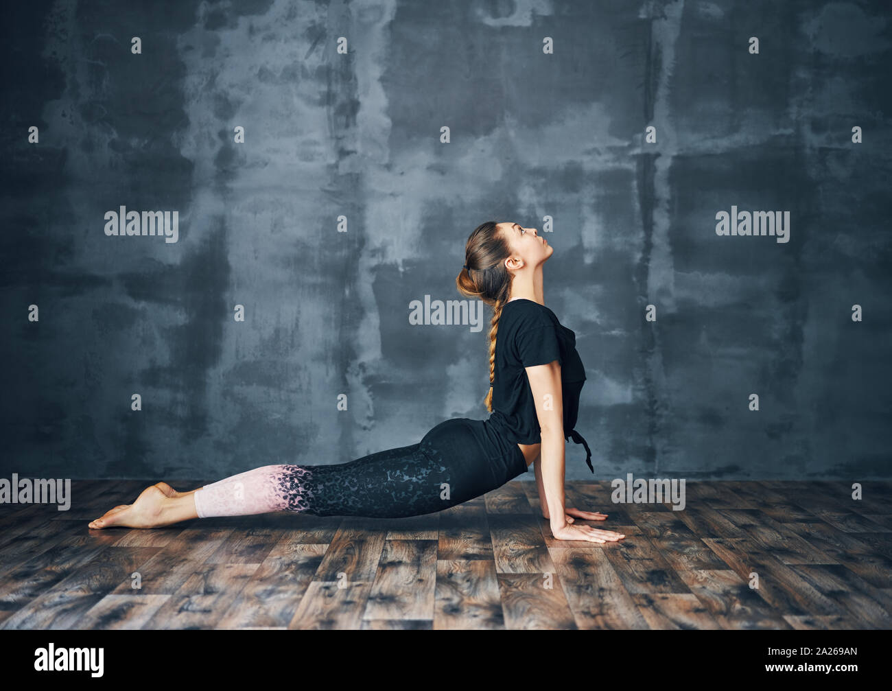 Girl doing bhujangasana cobra pose hi-res stock photography and images ...