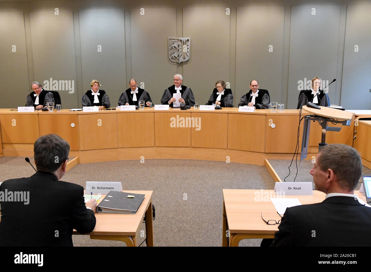 Schleswig, Germany. 01st Oct, 2019. The judges of the Schleswig-Holstein State Constitutional Court are sitting in the courtroom. In an oral hearing, the State Constitutional Court deals with the question of whether a general ban on fracking can be anchored in state law. The popular initiative for the protection of the water wants to regulate a Frackingverbot in Schleswig-Holstein over changes in the federal state water law. Credit: Carsten Rehder/dpa/Alamy Live News Stock Photo
