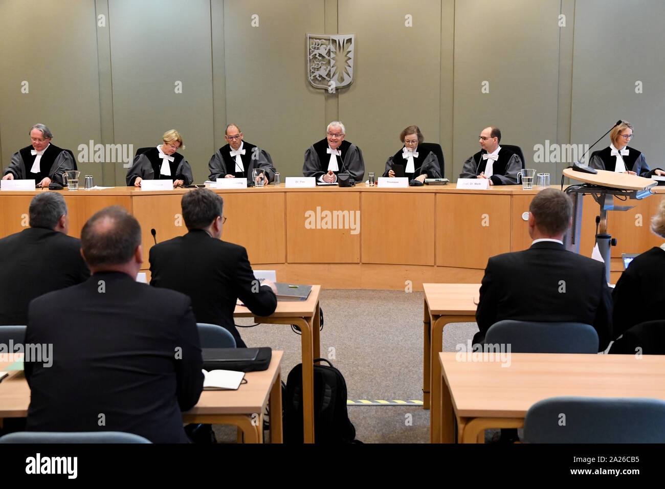 Schleswig, Germany. 01st Oct, 2019. The judges of the Schleswig-Holstein State Constitutional Court are sitting in the courtroom. In an oral hearing, the State Constitutional Court deals with the question of whether a general ban on fracking can be anchored in state law. The popular initiative for the protection of the water wants to regulate a Frackingverbot in Schleswig-Holstein over changes in the federal state water law. Credit: Carsten Rehder/dpa/Alamy Live News Stock Photo