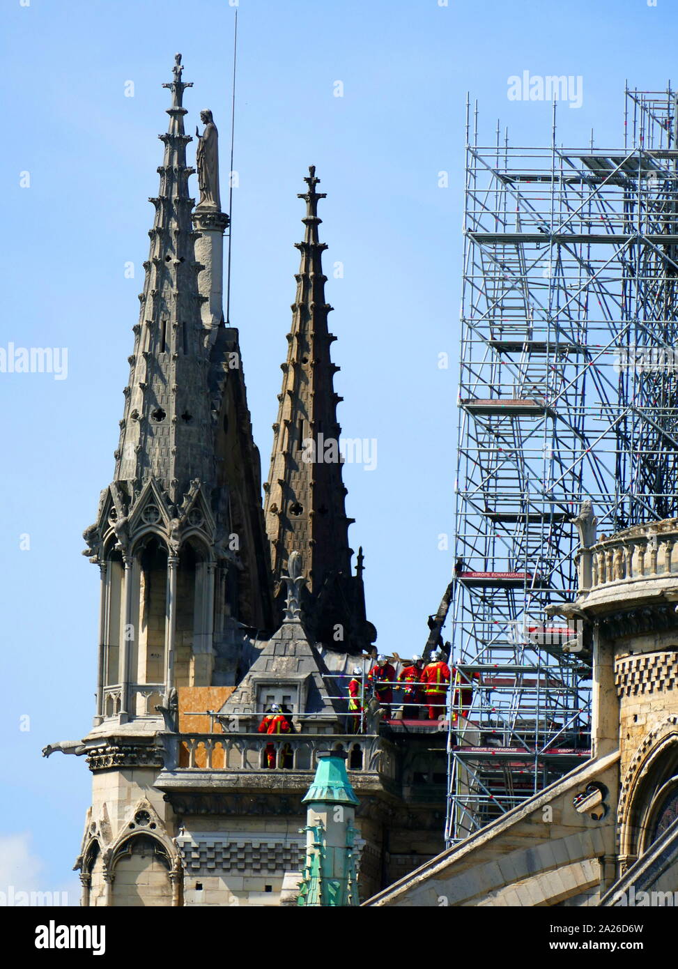Scene showing the impact of the fire which damaged Notre Dame Cathedral on the morning after the fire was extinguished. Fire crews inspect damage on the Cathedral. Stock Photo