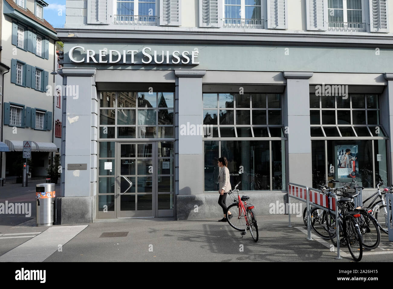 A Woman Walks Past Credit Suisse In Basel Switzerland Stock Photo Alamy