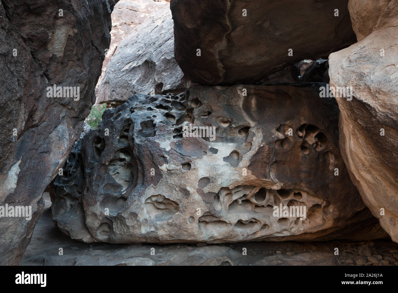 Pocked rocks in Hueco Tanks State Park & Historic Site in the low mountains above El Paso, Texas. The weathered rock is ideal for rockclimbing Stock Photo