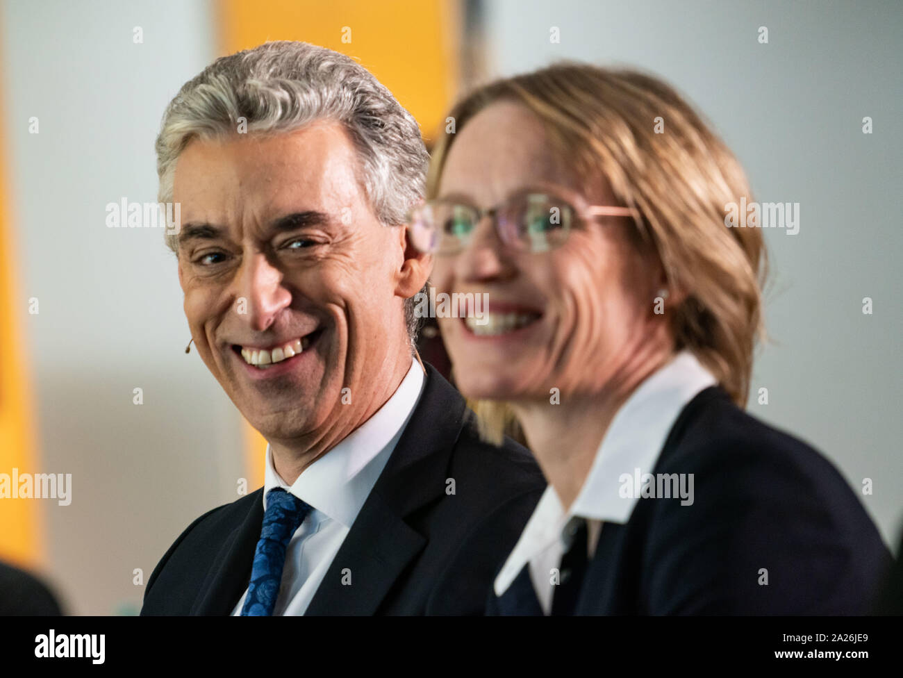 01 October 2019, Hessen, Frankfurt/Main: Frank Appel (l), CEO of Deutsche Post AG, and CFO Melanie Kreis (r) sit next to each other before the start of a press conference at which they present Deutsche Post's strategy until 2025. Every five years, the Bonn-based Group updates its approach. Photo: Frank Rumpenhorst/dpa Stock Photo