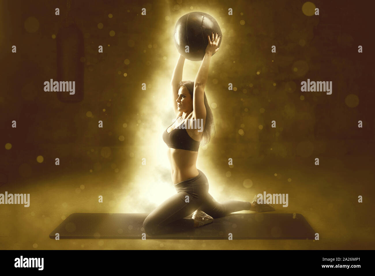 Sport woman training with functional gymnastic ball in the gym Stock