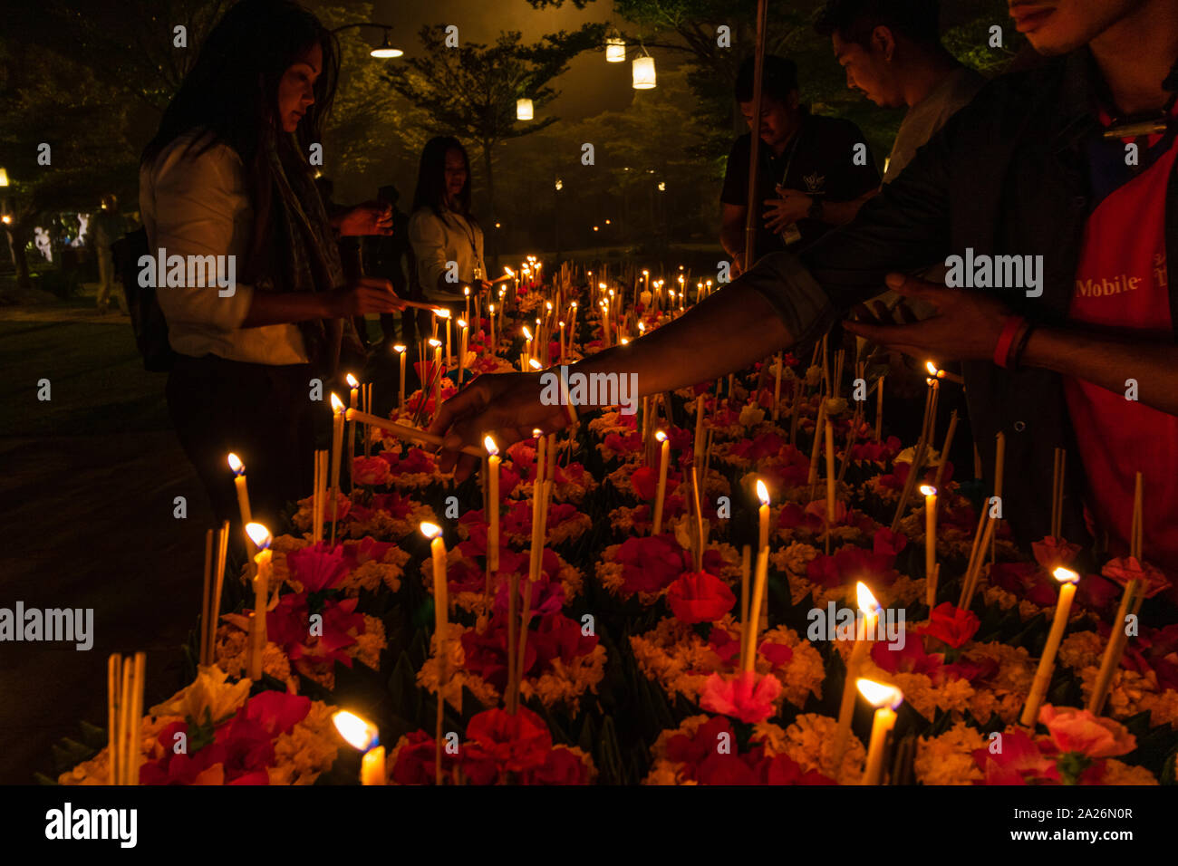 https://c8.alamy.com/comp/2A26N0R/loi-krathong-festival-in-chiangmai-thailand-hand-releasing-floating-decorated-baskets-and-candles-to-pay-respect-to-river-goddess-thai-traditional-2A26N0R.jpg