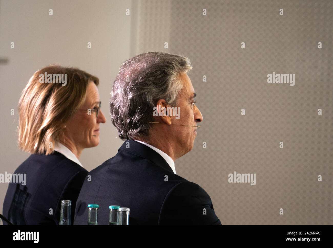 01 October 2019, Hessen, Frankfurt/Main: CFO Melanie Kreis (l) and Frank Appel (r), CEO of Deutsche Post AG, are sitting next to each other before the start of a press conference at which they present Deutsche Post's strategy up to 2025. Every five years, the Bonn-based Group updates its approach. Photo: Frank Rumpenhorst/dpa Stock Photo