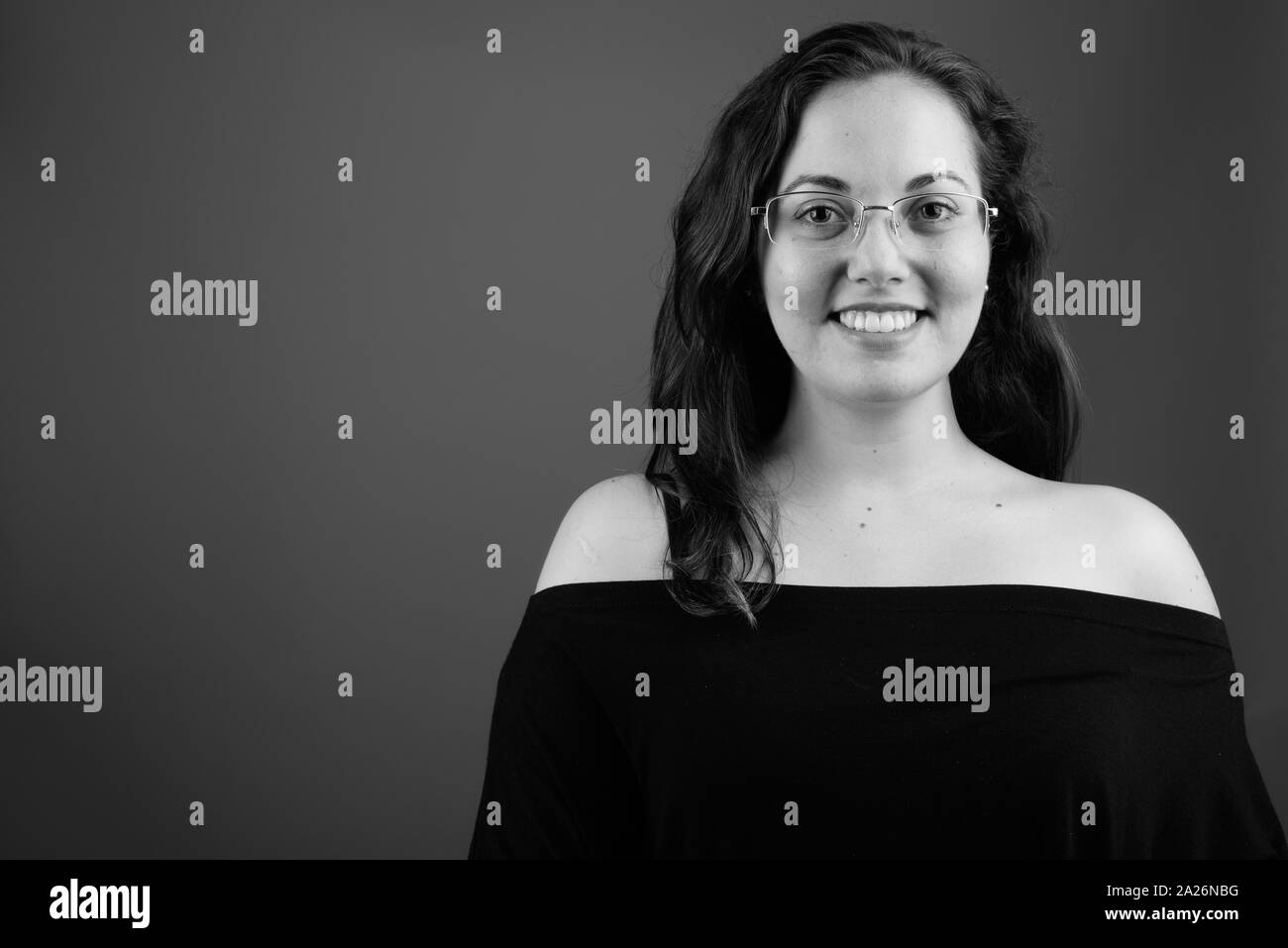 Portrait of young happy woman smiling shot in black and white Stock ...