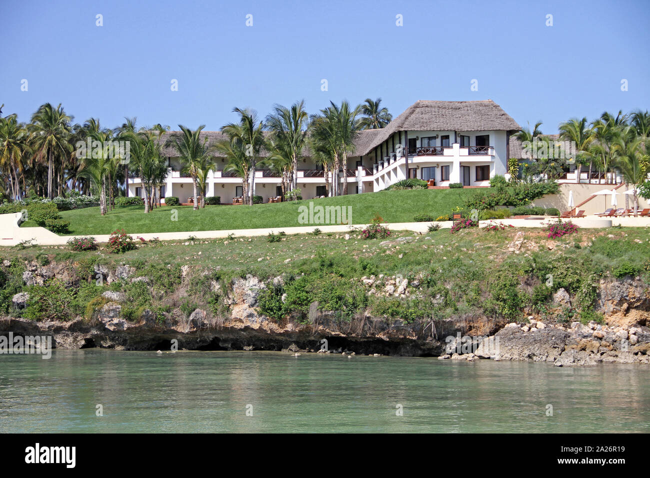 Sea Cliff Resort and Spa Hotel and other residence buildings along the Eastern Coast of zanzibar on the shore, Zanzibar, Unguja Island, Tanzania. Stock Photo