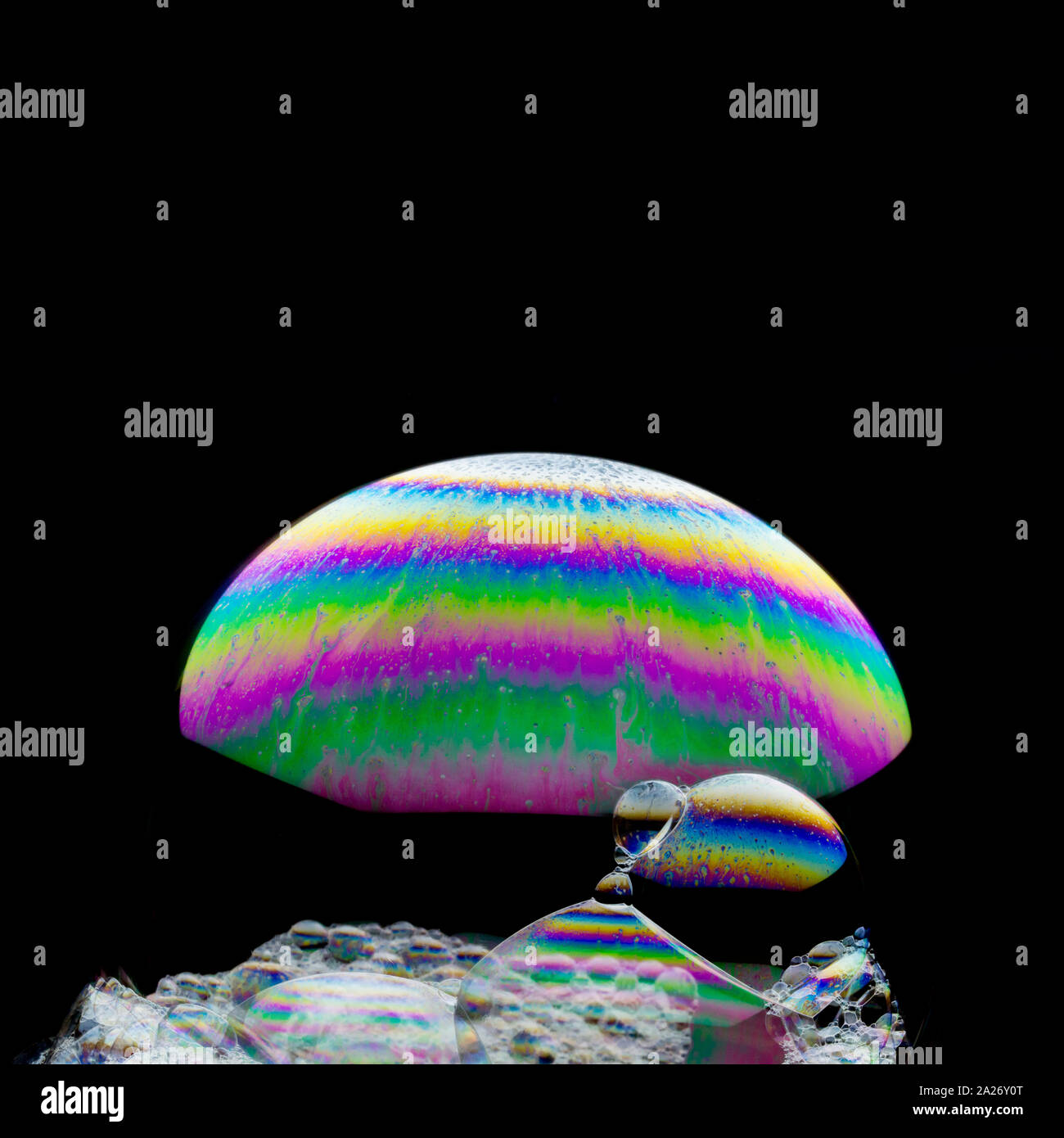 Cosmic bubble waterfall - beautiful soap-bubble abstract on black background Stock Photo