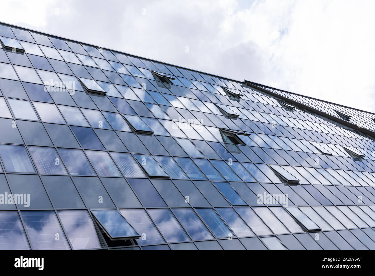 Glass building facade with open windows, business centre architecture ...