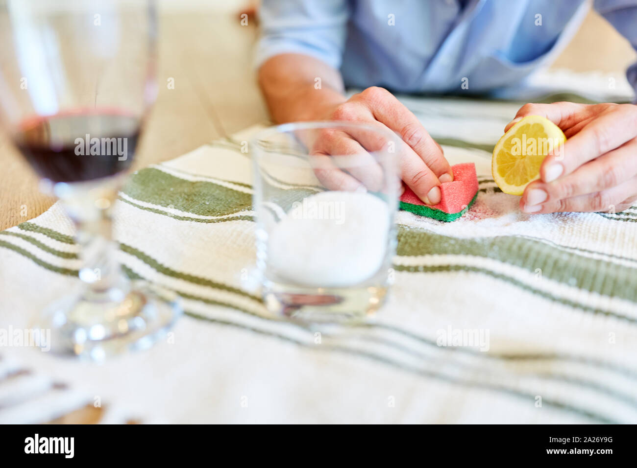 Salt and lemon as a traditional cleaning agent to remove red wine stains Stock Photo