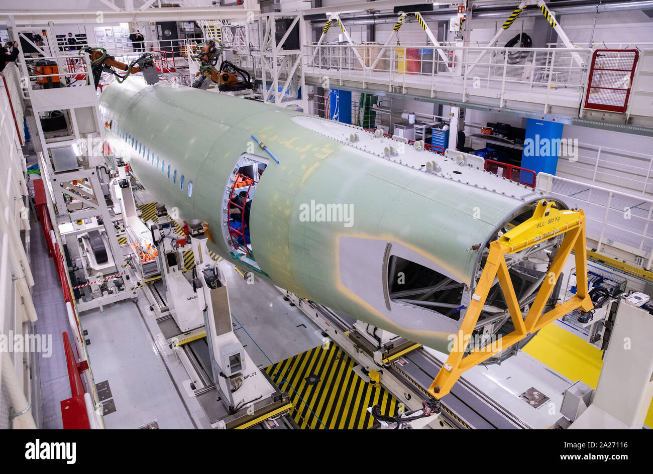 Hamburg, Germany. 01st Oct, 2019. Four robots (partly covered) drilling ...