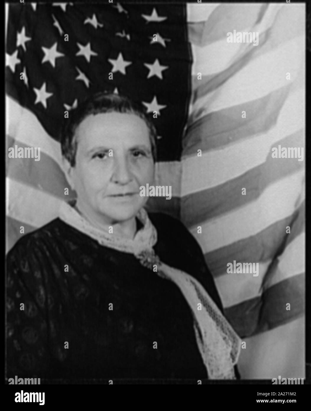 Portrait of Gertrude Stein, with American flag as backdrop Stock Photo