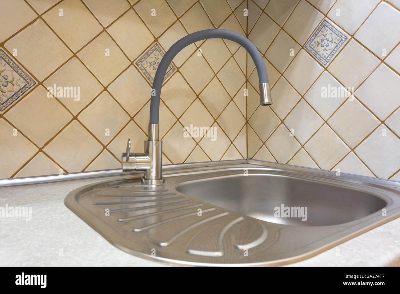 Steel Water Tap Sink With Faucet In Expensive Loft Kitchen Stock