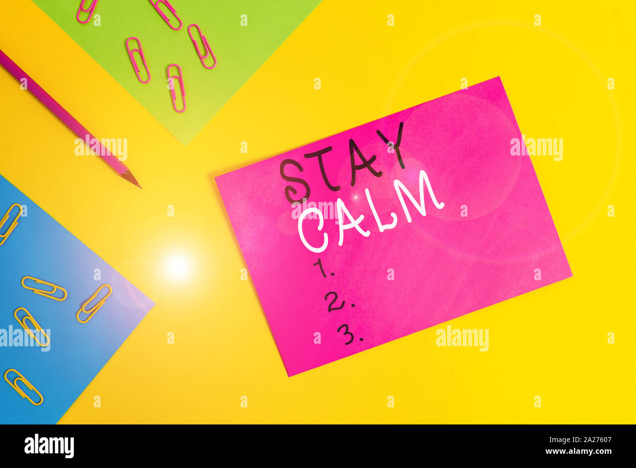Word writing text Stay Calm. Business photo showcasing Maintain in a state of motion smoothly even under pressure Blank paper sheets message pencil cl Stock Photo