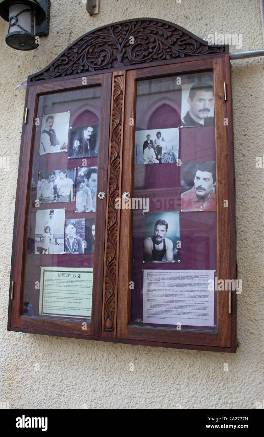 Memorial, history and photos of Freddie Mercury from the band queen on pinboard outside the Mercury House, Stone Town (his birthplace), Zanzibar, Unguja island, Tanzania. Stock Photo