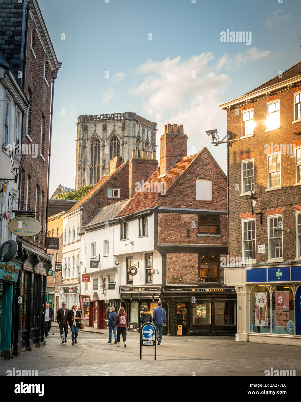 York Minster seen through the medieval streets of York's historical town centre Stock Photo