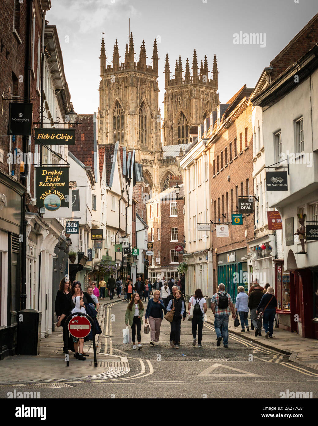 York Minster seen through the medieval streets of York's historical town centre Stock Photo