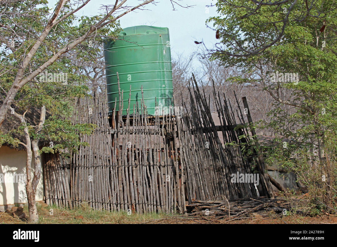 Water tank surrounded by a wooden fence, Zimbabwe. Stock Photo
