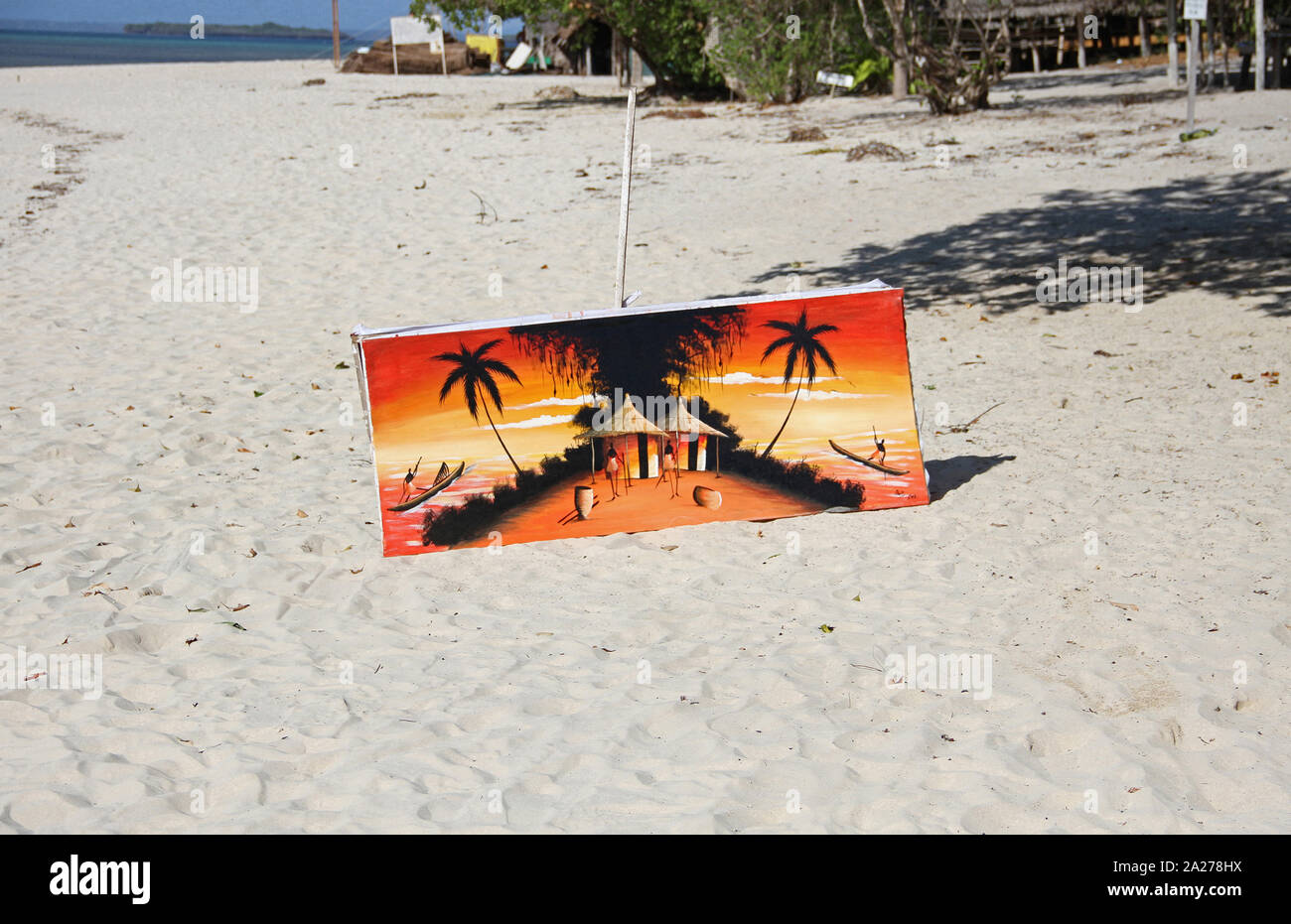Orange canvas painting for sale on beach, Zanzibar, Unguja Island, Tanzania. Stock Photo