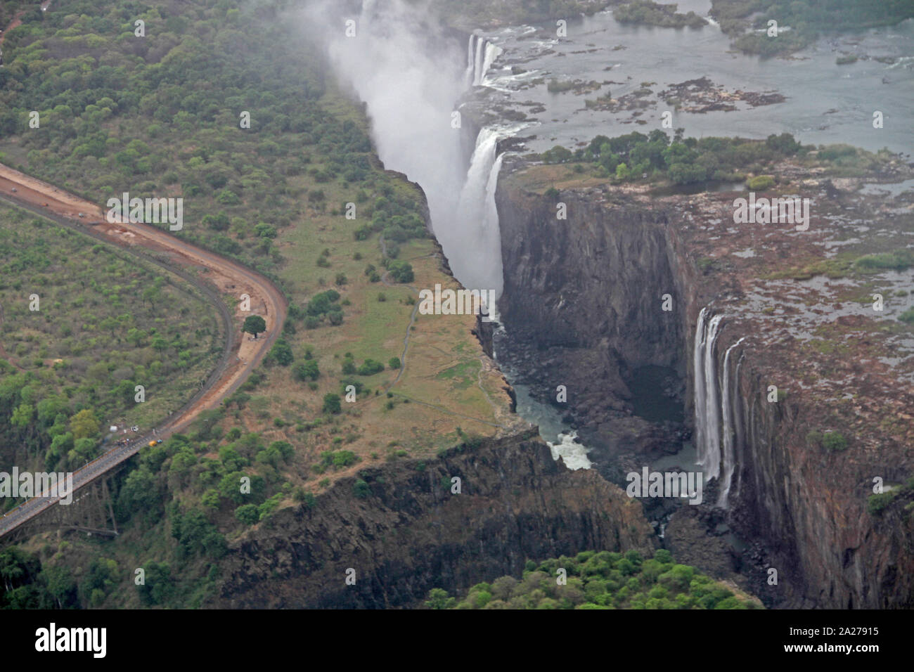 Aerial view on top of Victoria Falls, Zambezi River gorge valley and Victoria Falls Bridge, Zimbabwe/Zambia. Stock Photo