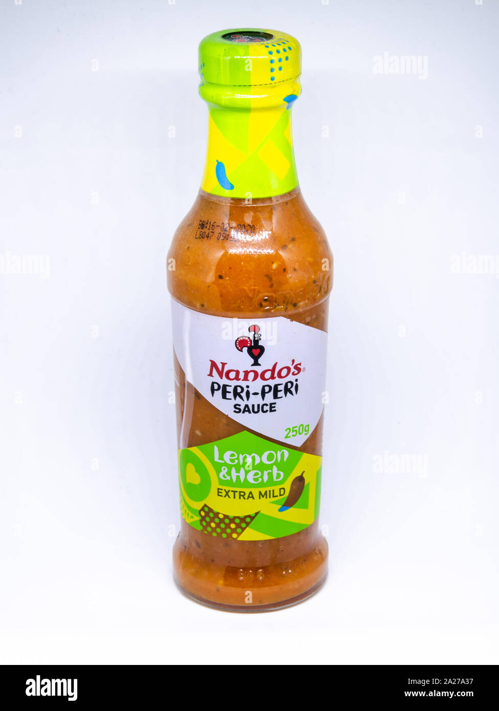 A jar of Nando's Peri-Peri lemon and herb flavour sauce pictured against a white background. Stock Photo