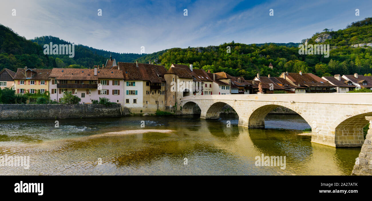 St. Ursanne, Jura / Switzerland - 27 August 2019: panorama of the historic and picturesque Swiss village of Saint-Ursanne on the Doubs River Stock Photo