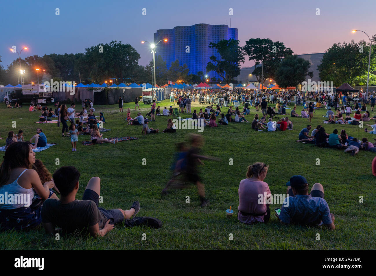 People gather in Flushing Meadows Corona Park for the Queens Night