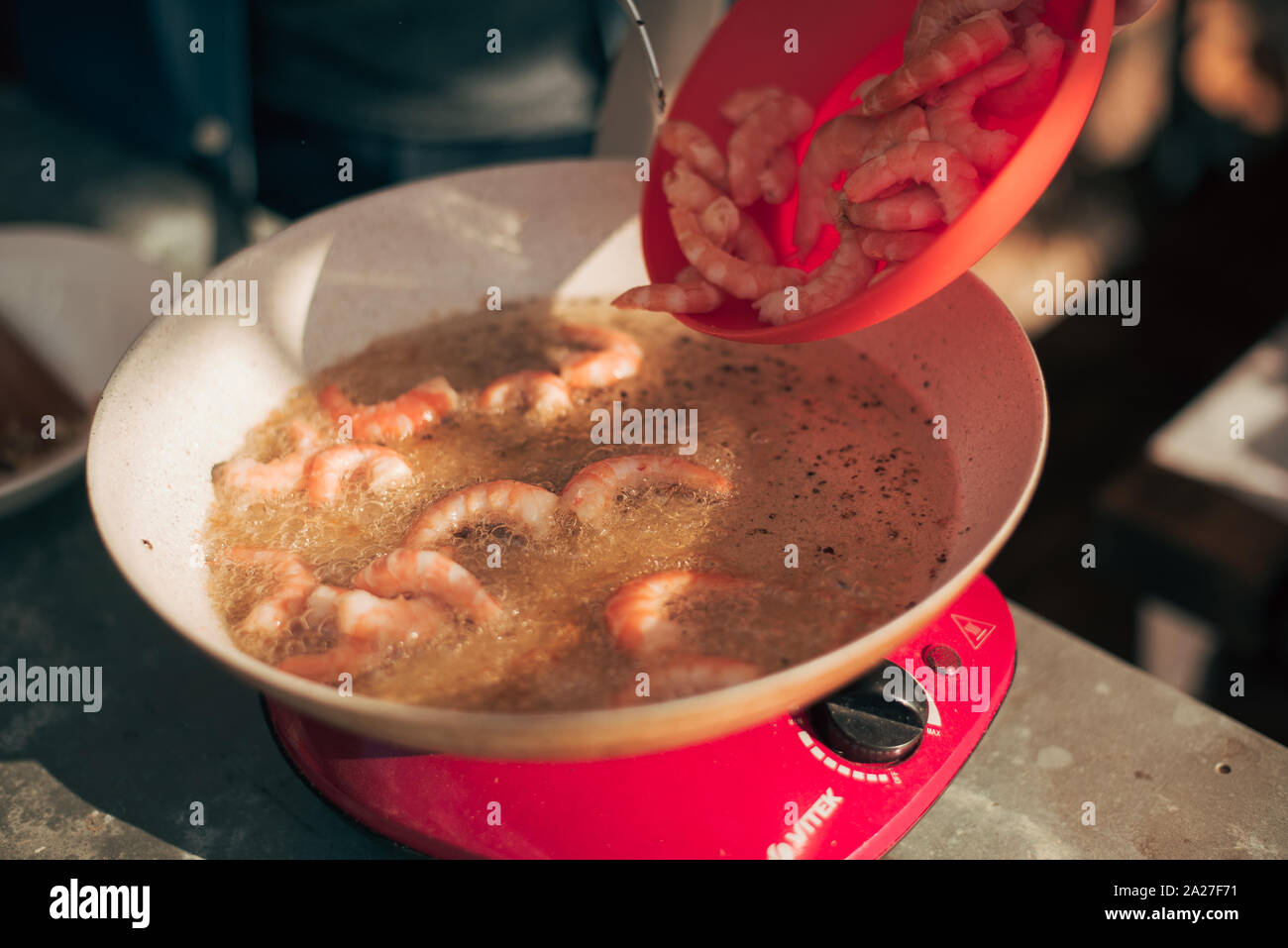 Fry the prawns in hot olive oil. Grill in the open air Stock Photo Alamy