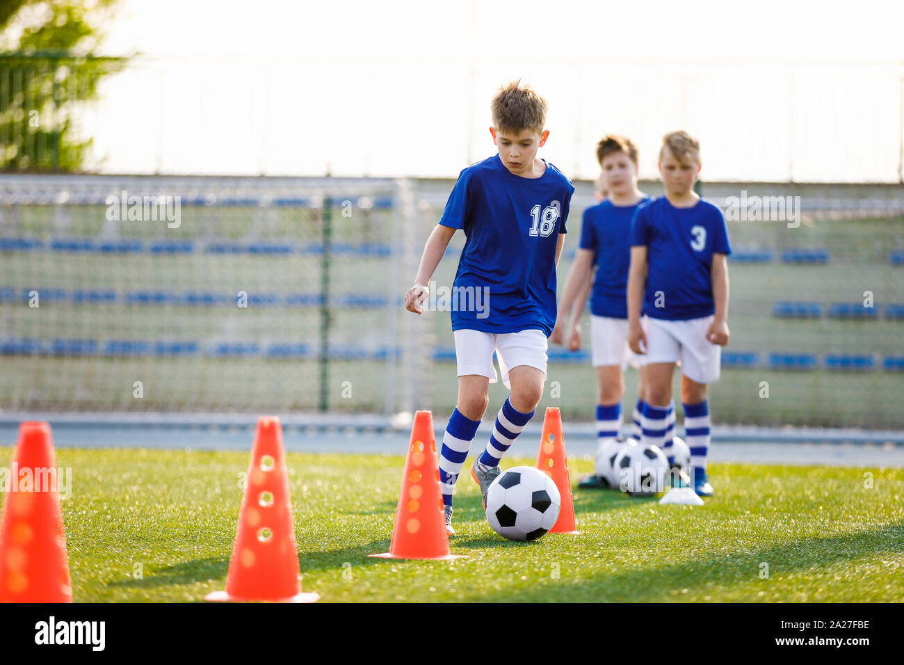Group of football training cones on the soccer field Photos