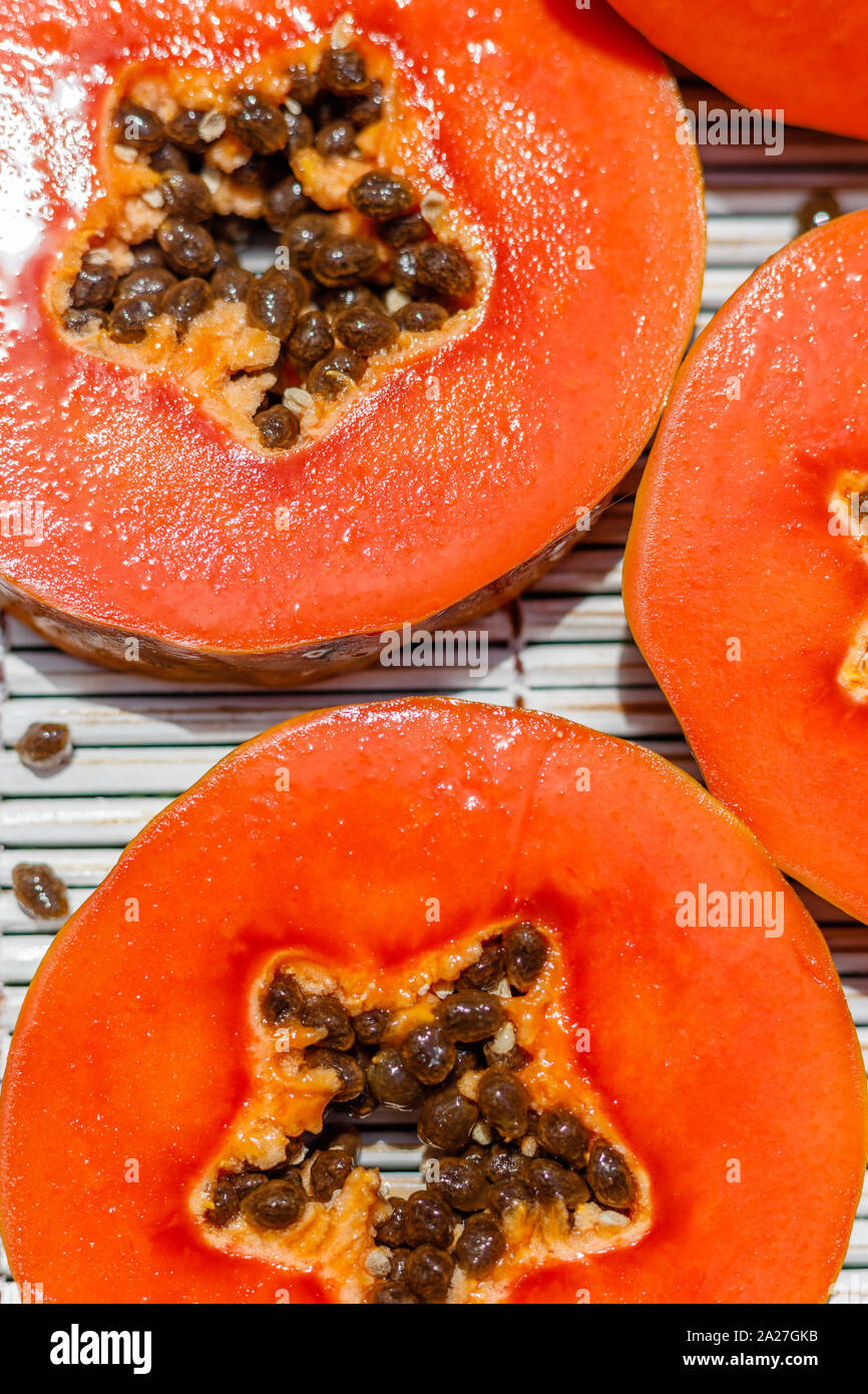 Fresh papaya cut in round pieces, with a star shape middle. Bali