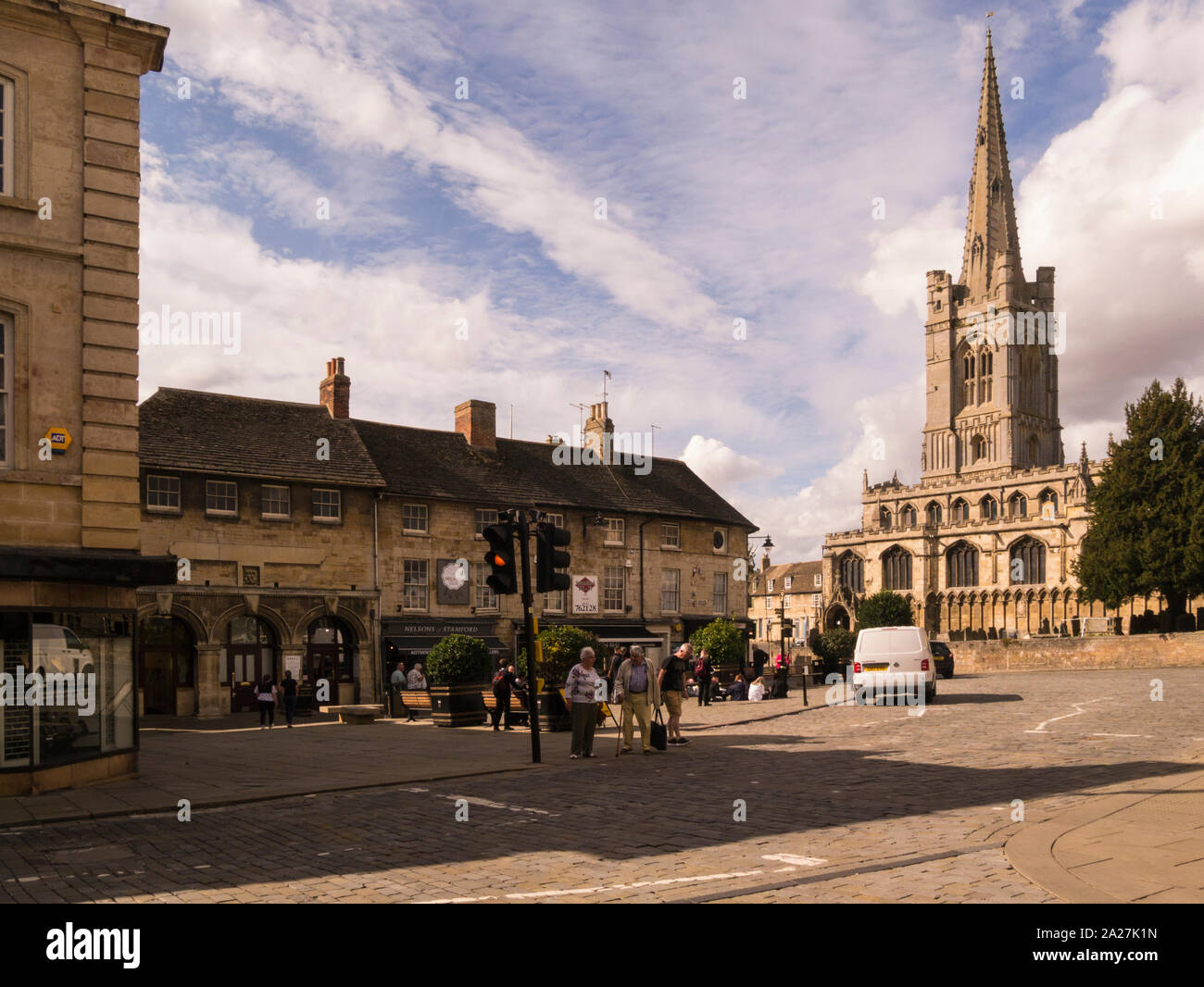 Red Lion Square and All Saints Church in the centre of historic town Stamford Lincolnshire Eastern England UK popular film location on a lovely Septem Stock Photo