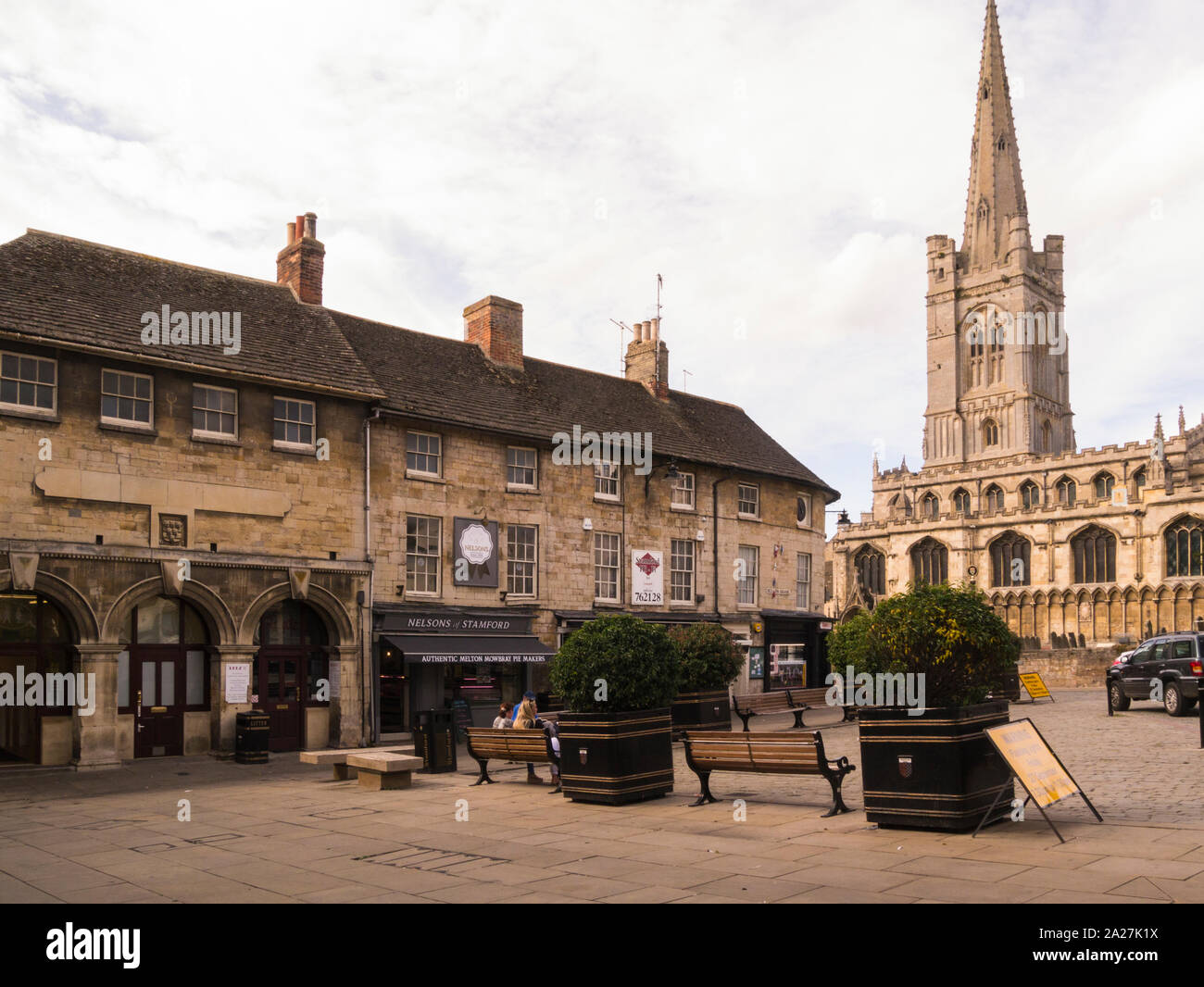 Red Lion Square and All Saints Church in the centre of historic town Stamford Lincolnshire Eastern England UK a popular film location on a lovely Sept Stock Photo