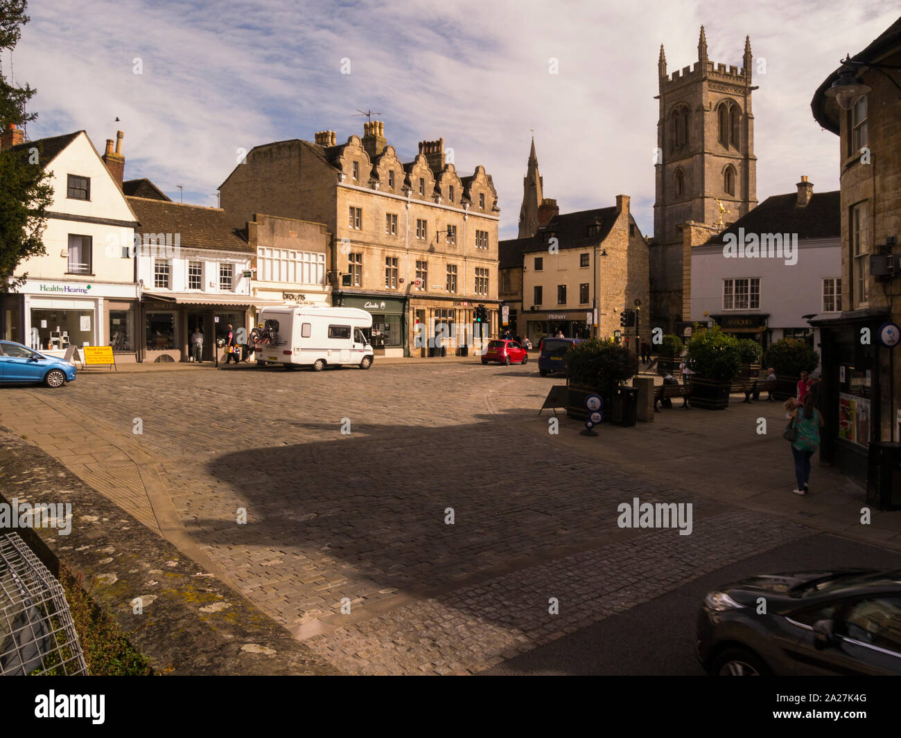 View across Red Lion Square showing two parish churches Stamford Lincolnshire Eastern England UK on a lovely September day in this attractive historic Stock Photo