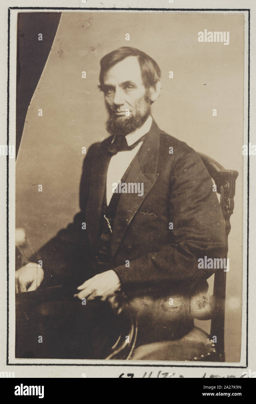 President Abraham Lincoln, three-quarter length portrait, seated, May 16, 1861 Stock Photo