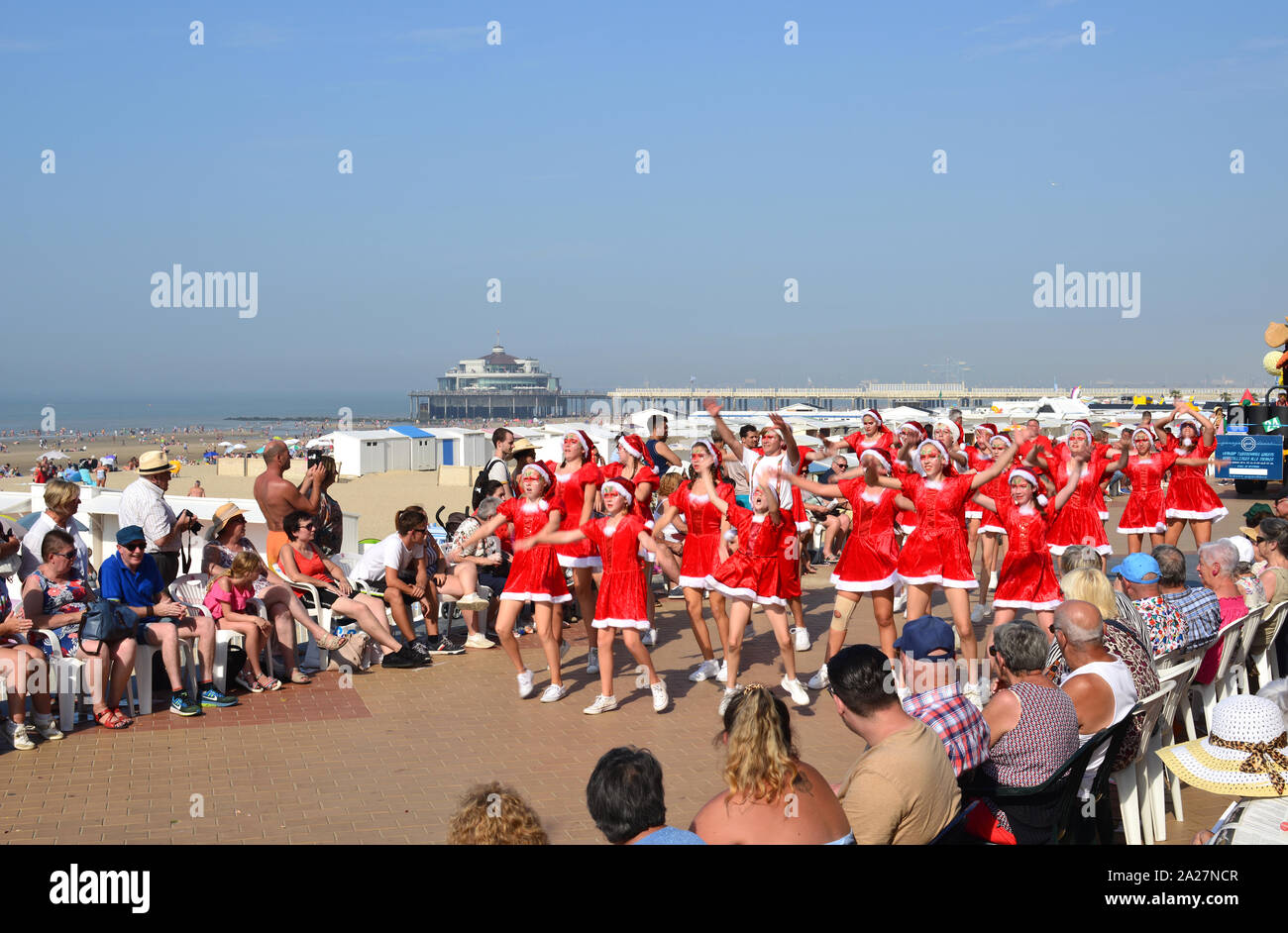 Blankenberge, West Flanders/ Belgium - August 25, 2019:: Beach festivity  flower corso, in Flemish called 'Bloemencorso'. Teens dressed as Santa Claus. Stock Photo