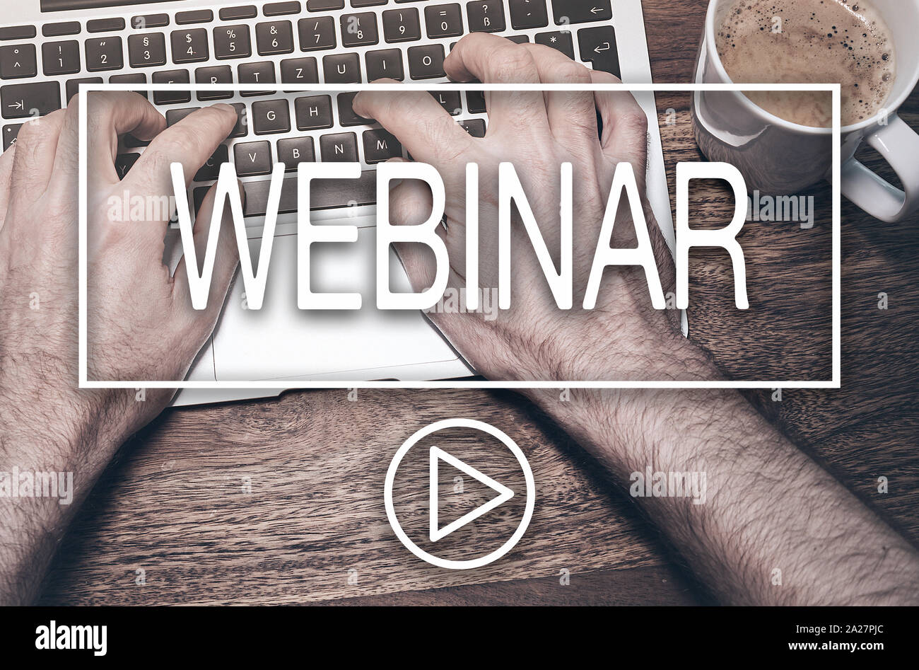 word WEBINAR and play button against hands of man working on laptop computer, e-learning concept Stock Photo