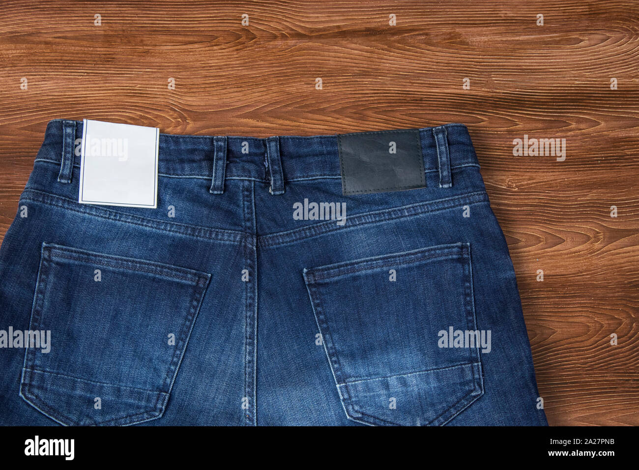 Download Jeans Label Mockup Denim Texture Isolated Wooden Background Stock Photo Alamy