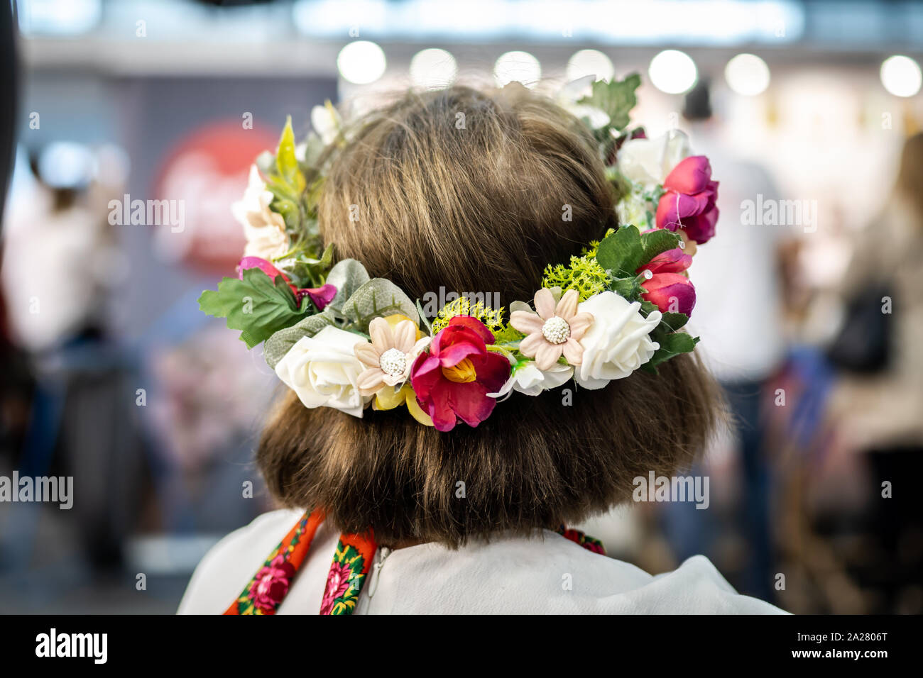 Polish woman in traditional polish folk dress wearing a flower crown. Stock Photo