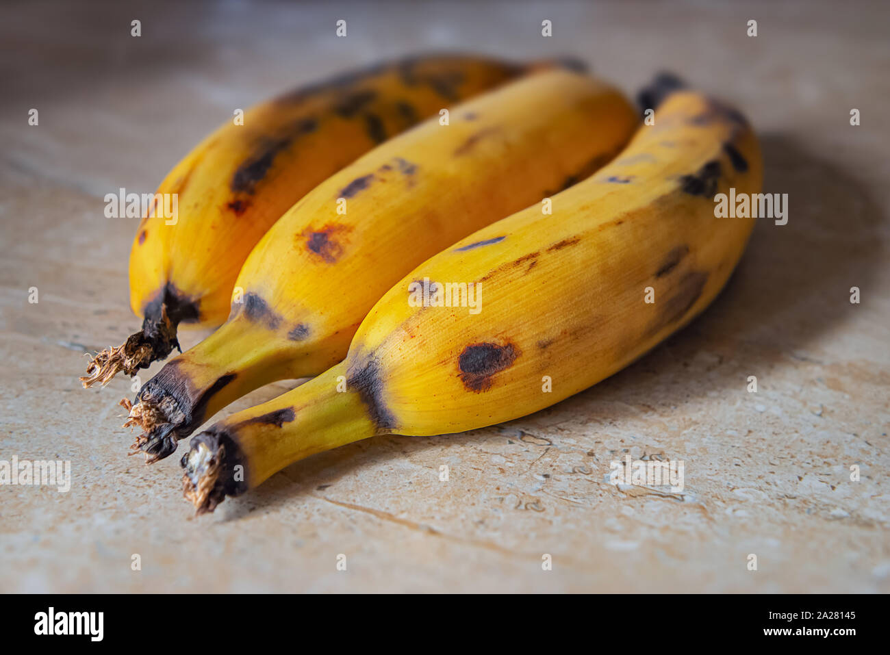 Plantain fruit top kitchen counter ripe two organic raw food close up Stock Photo