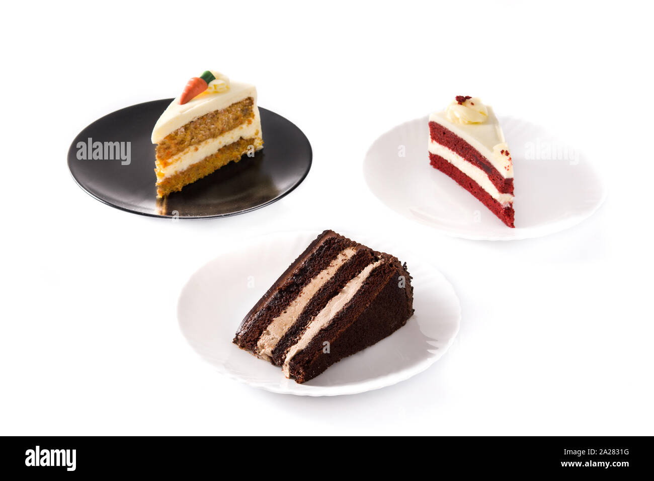 Assortment of sweet cake slices. Chocolate, carrot and velvet cake slices isolated on white background Stock Photo