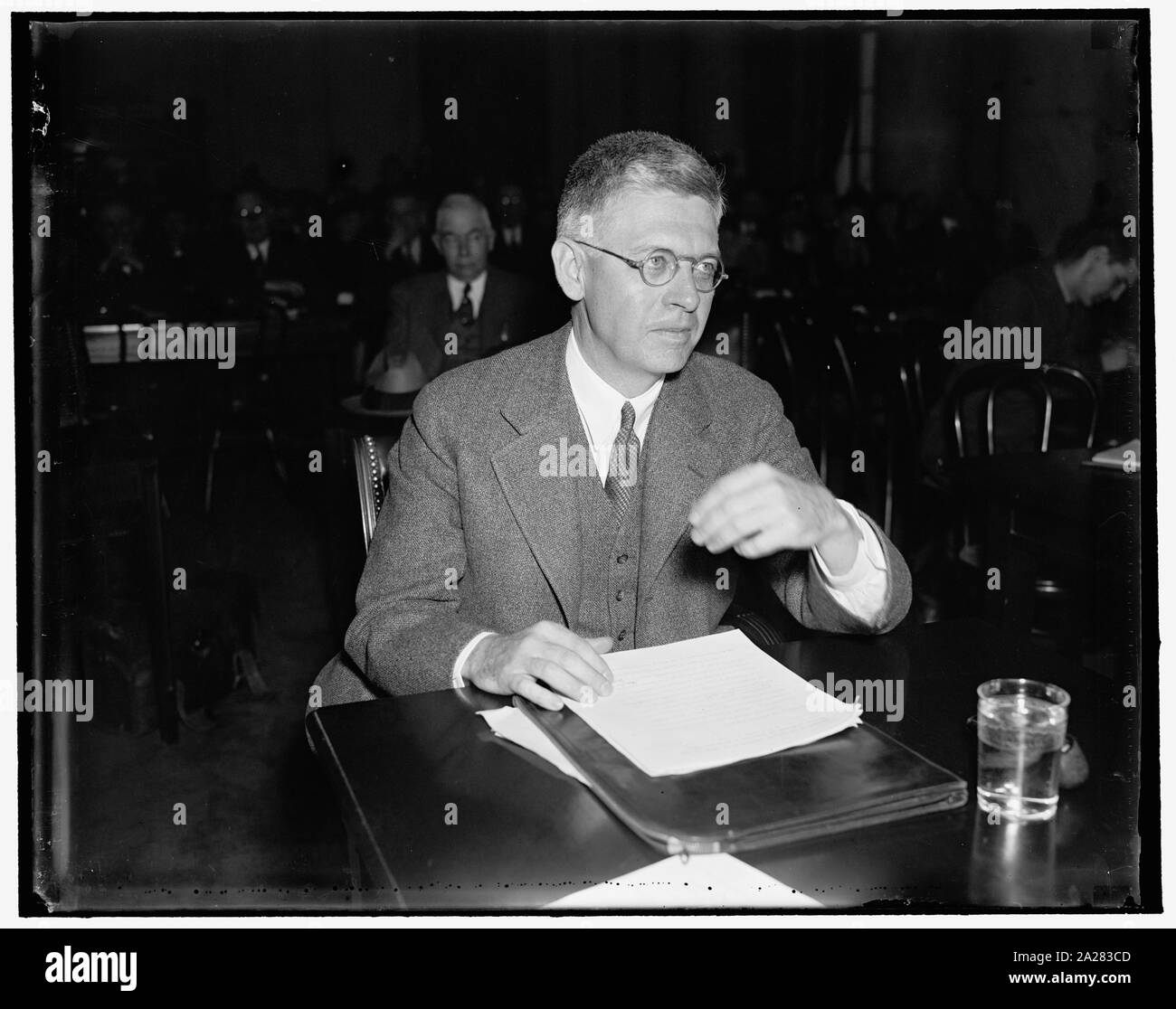 Princeton Prexy gives Senate Committee views on president's court reform plan. Washington, D.C., March 24. Harold W. Doods, President of Princeton University, testifying before the Senate Judiciary Committee today pictured the President's court reorganization plan as a scheme by which President Roosevelt hopes to control the opinions of the court. The committee is now hearing witnesses opposed to the president's plan, 3/24/1937 Stock Photo