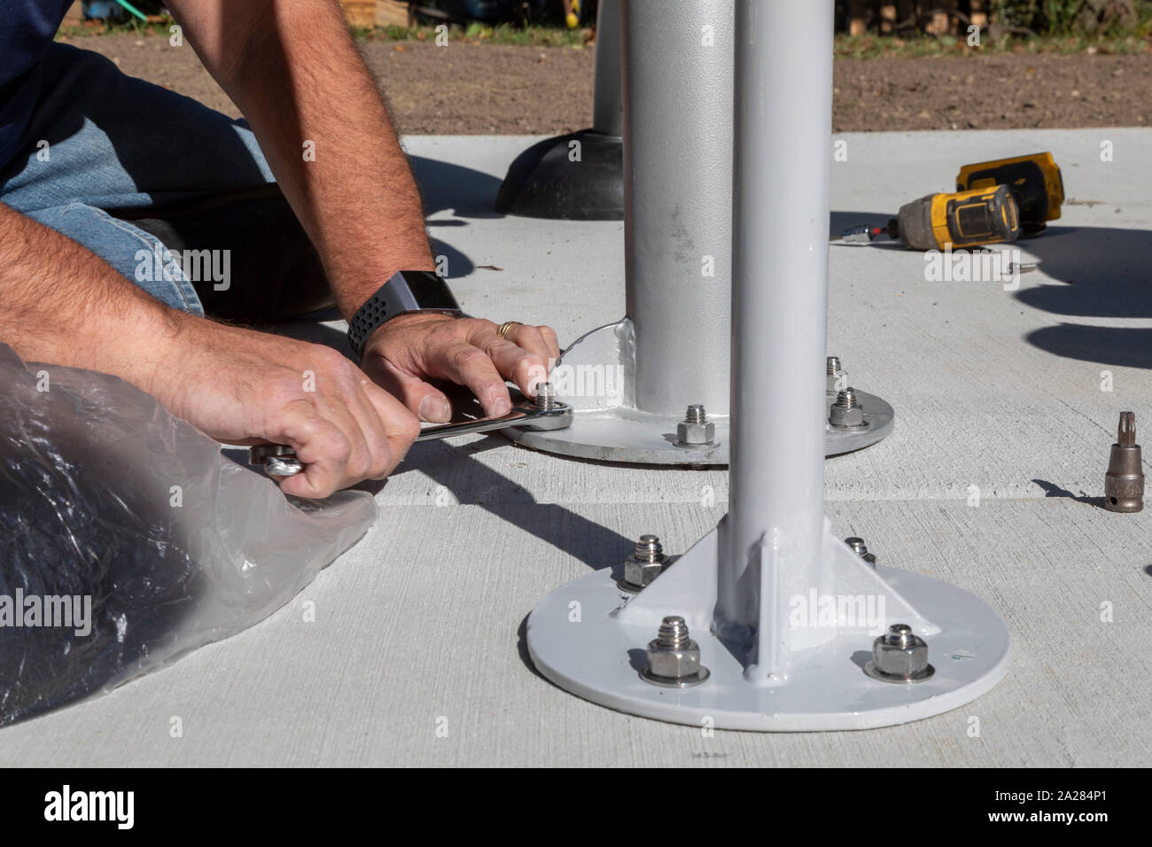 Detroit, Michigan - Volunteers from Cooper Standard install exercise equipment in a new community park in the Morningside neighborhood. Stock Photo