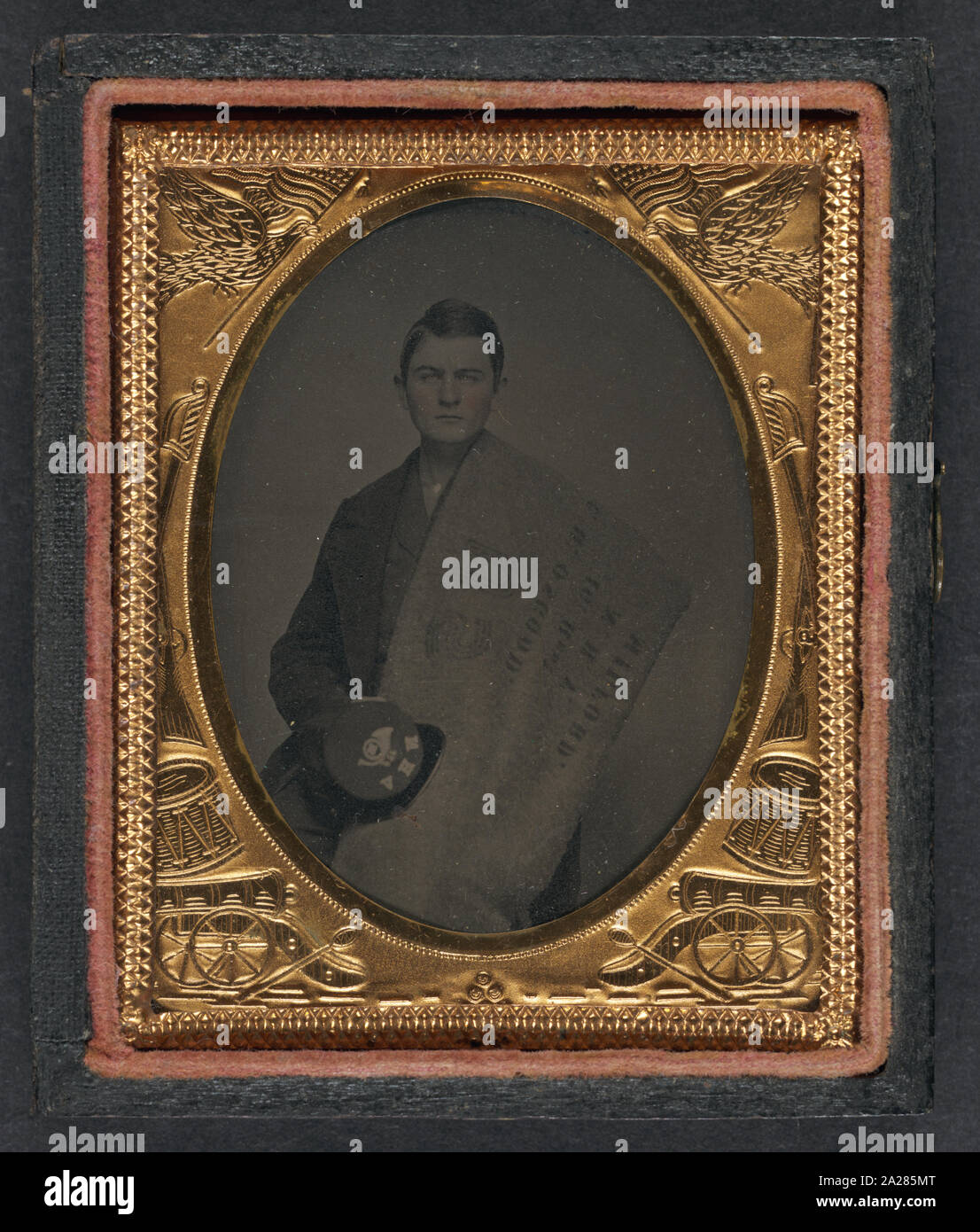 Private Charles H. Osgood of Company C, 16th New Hampshire Infantry Regiment with stenciled blanket and forage cap Stock Photo