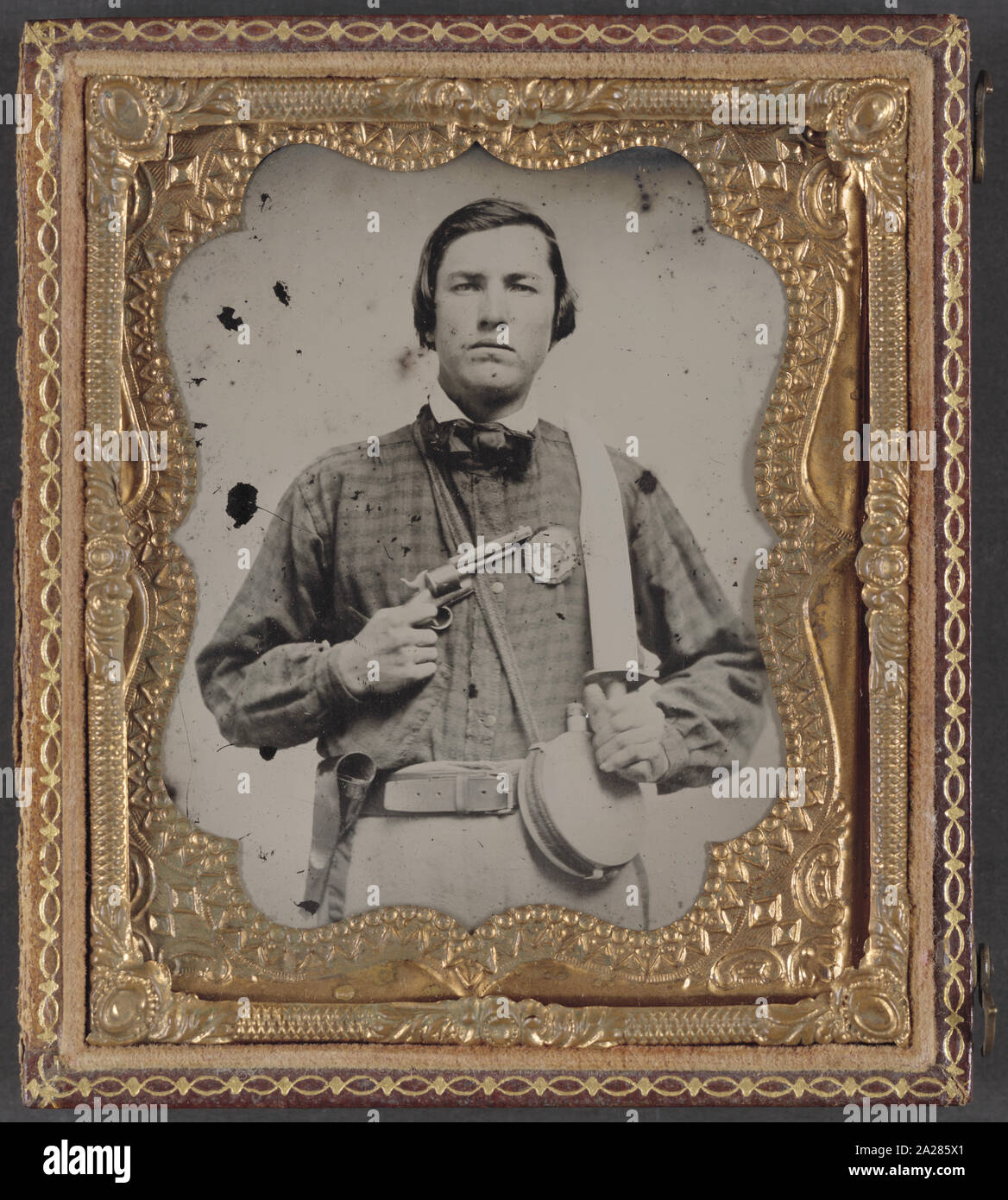 Private David C. Colbert of Company C, 46th Virginia Infantry Regiment, with secession badge, canteen, pistol, and Bowie knife Stock Photo
