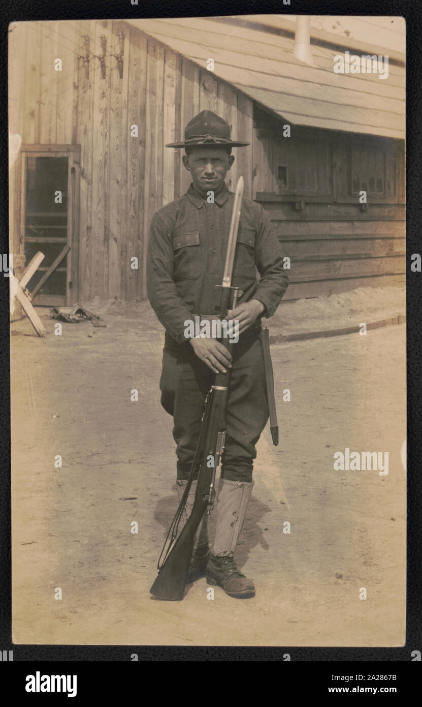 Private John H. Rowe of Co. B, 16th Infantry Regiment in uniform with bayoneted rifle Stock Photo